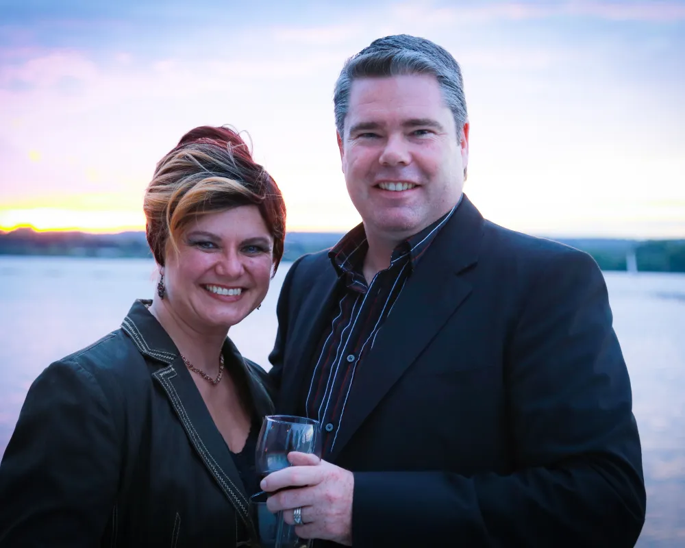 Sean and his wife, Anna-Maria, at sunset by the lake